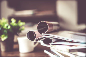 selective focus of  stacking magazine place on table in living room