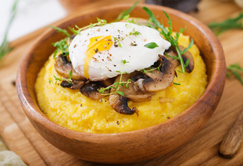 Breakfast. Polenta with mushrooms and poached egg