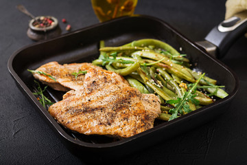 Turkey- chicken fillet cooked on a grill and garnish of green beans.