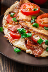 Omelette with bacon and tomatoes