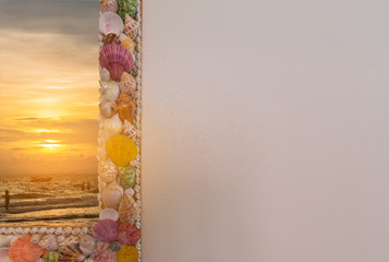 the beach and wall decorated with seashells.