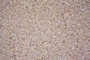 textured background and a mosaic of small pebbles