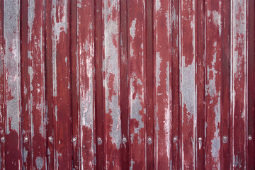 textured background of a fence with peeling paint