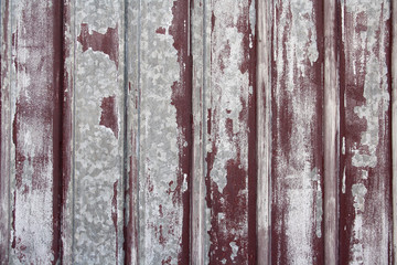 textured background of a fence with peeling paint
