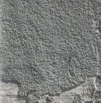 the plaster linear decoration on white and grey wall.