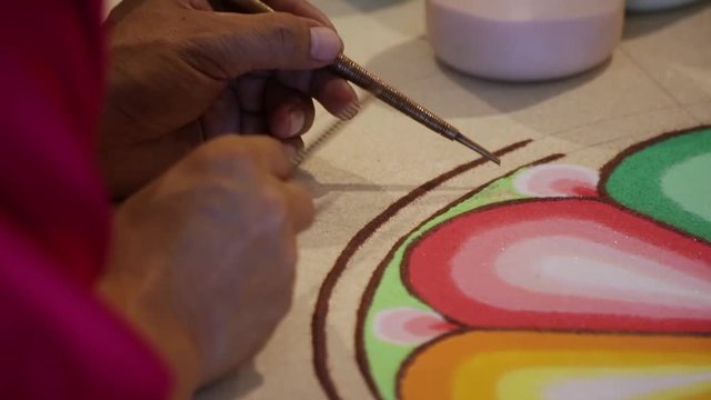 Tibetan monks making sand mandala - sequence of closeup - different shots