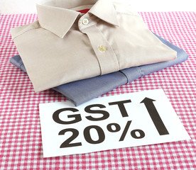 GST, goods and services tax, concept for ready made garments, including shirts.
