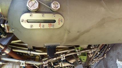 turbofan of an modern airliner aircraft opened for an inspection with oil level indicator