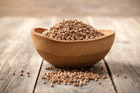 Buckwheat Groats In Wooden Bowl