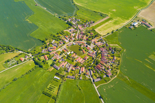 Aerial view of beautiful village in summer countryside. Old village Lipnice in Brdy, Czech republic, Europe. Rundling is a form of circular village. Typical medieval settlement.