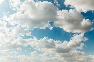 Naklejka na ściany i meble Blue sky with clouds, background.