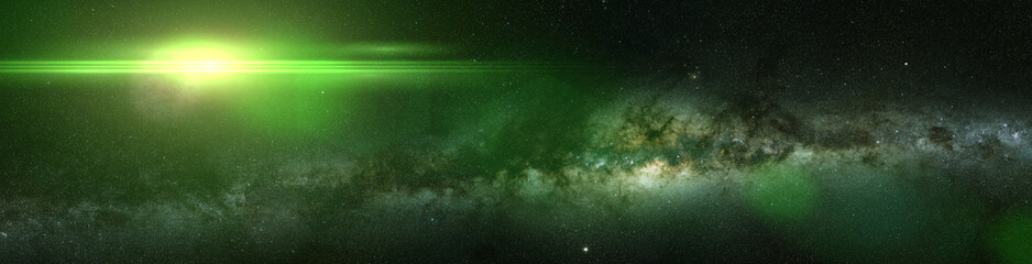 Naklejka premium bright green star and the Milky Way galaxy