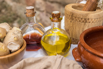Olive oil and vinegar in bottles on old wooden table