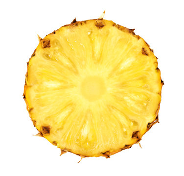Round pineapple slice isolated on white background