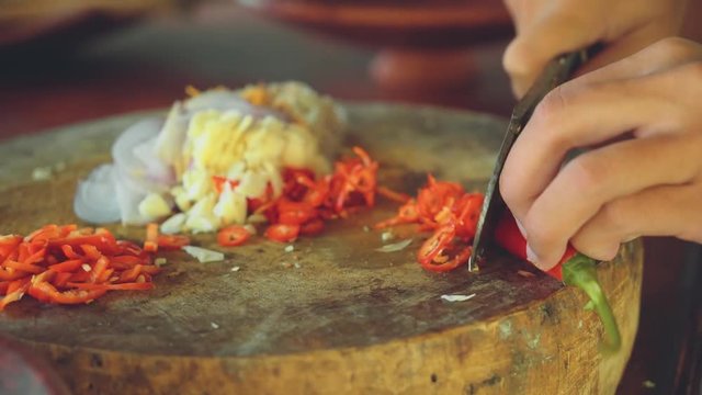 Close up of red pepper chopping on balinese kitchen