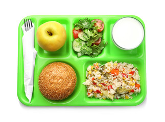 Serving tray with delicious food on white background. Concept of school lunch