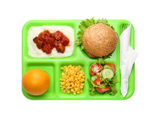 Serving tray with delicious food on white background. Concept of school lunch