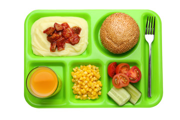Serving tray with delicious food on white background. Concept of school lunch