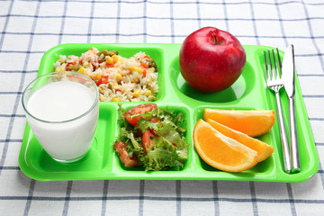 Serving tray with delicious food on tablecloth. Concept of school lunch
