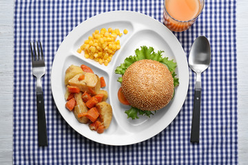 Serving tray with delicious food on table. Concept of school lunch