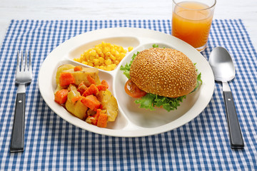 Serving tray with delicious food on table. Concept of school lunch