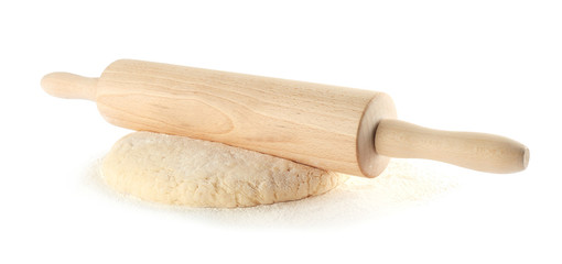 Ball of raw dough and rolling pin on white background