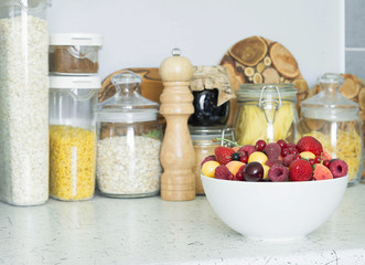Assorted berries in a bowl on the kitchen table