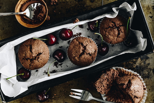 Chocolate muffins with fresh cherries