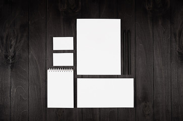 Stationery set for corporate identity on black nior wood background. Mock up for branding, business presentations and portfolios.