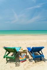 Woman sitting on a chair at the beach
