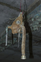 Gas Mask hanging in Abandoned Room in Ghost Town of Pripyat within Chernobyl Exclusion Zone