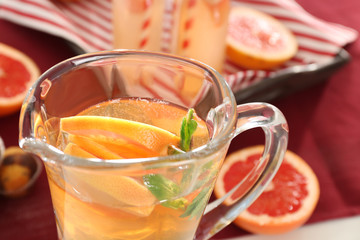 Jug with refreshing lemonade, closeup