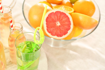 Glassware with different kinds of lemonade on table