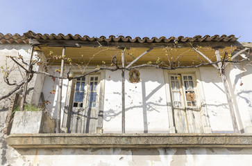 old balcony on a typical white house in Alentejo region, Portugal