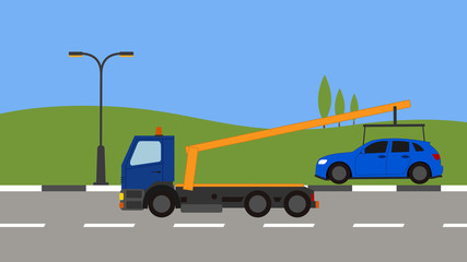 Tow truck picking up a car in town