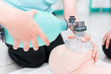 Nursing students are learning how to rescue the patients in emergency. CPR training with CPR doll...