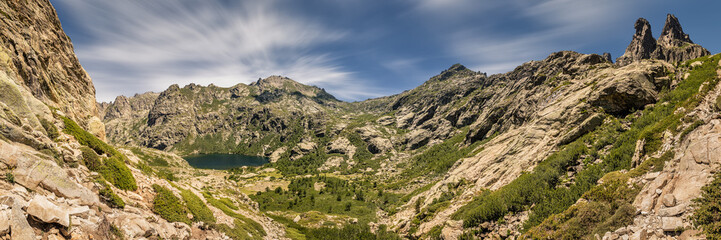 Fototapeta na wymiar Panoramic view of Lac de Melo and mountain peaks in Corsica