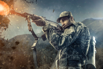 Close-up of man shooting with machine gun