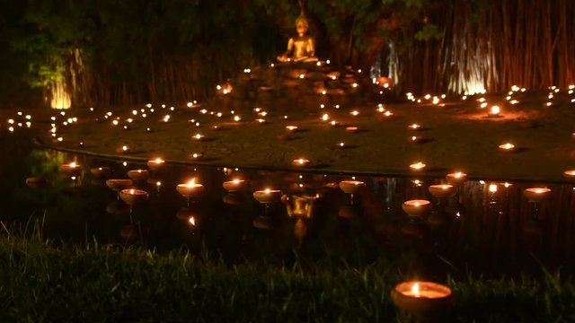 Candles light offering for Buddha in Chiangmai, Thailand.