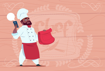 African American Chef Cook Holding Packet With Food And Mobile Phone Restaurant Delivery Concept Chief Over Wooden Textured Background Flat Vector Illustration