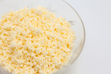 Traditional Colombian Arepa de Choclo Preparation : Transparent bowl filled with shredded cheese