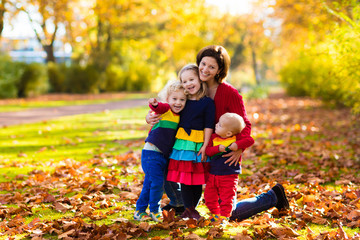 Mother and kids in autumn park