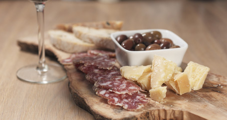 italian antipasti appetizers with wine glass