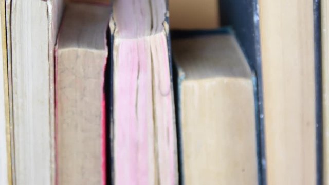 Vintage books. View of row of old books and vintage typewriter