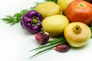 Assortment of fresh raw vegetables on white background. Selection includes potato, tomato, green onion, pepper, garlic and dill