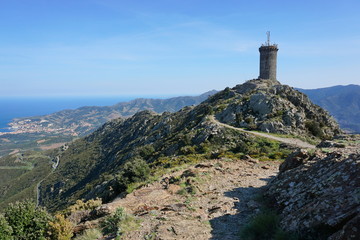 Fototapeta na wymiar The Madeloc medieval watchtower, old stone tower overlooking the Vermilion coast, Mediterranean, Pyrenees Orientales, Roussillon, south of France