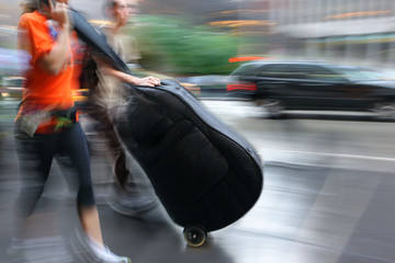 people with musical instrument on a city street