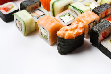 Set of sushi, maki and rolls on white background