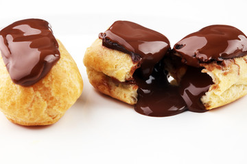 Traditional French dessert. Eclair with chocolate icing. Pastery concept