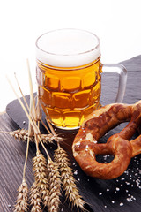 Beer in a mug. Oktoberfest salted soft pretzels and beer from Ge
